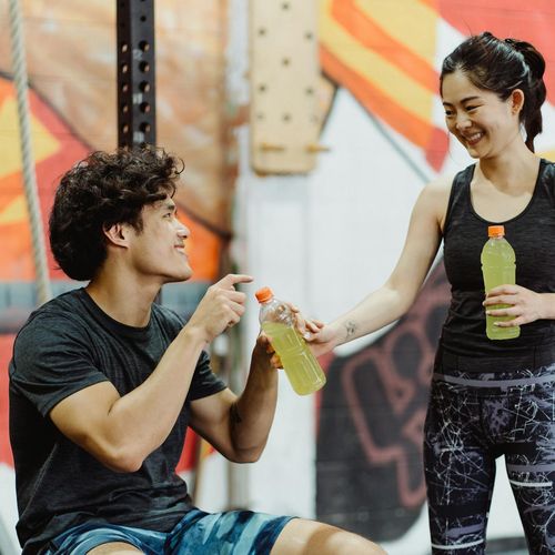 Smiling woman in sportswear giving a positive review.